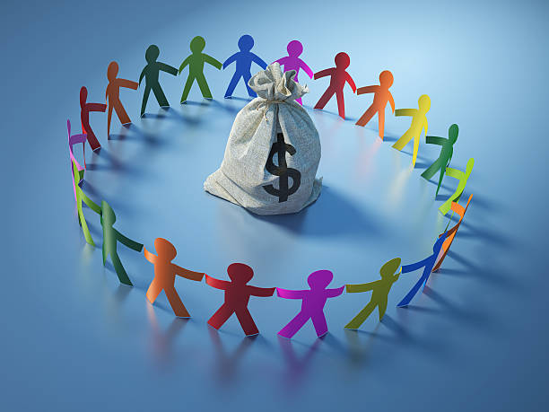 istock Circle of People with Money Sack 586713636