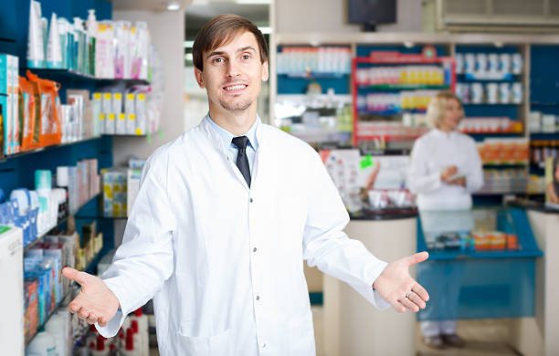 istock pharmaceutists working in chemist shop 586714610