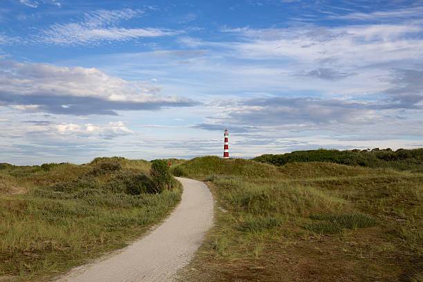 маяк амеланд с дюнами - nes стоковые фото и изображения
