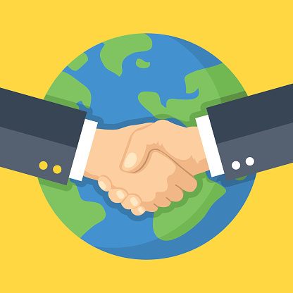 Business handshake and Earth. Global business, partnership. Two hands shaking one another. Flat design vector illustration