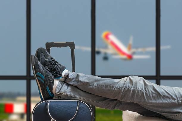 istock Delayed aeroplane concept. Tired passenger is awaiting airplane arrival. 586716750