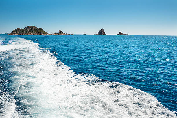 istock Waves on blue sea behind the boat 586717100
