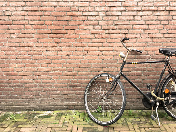 istock Old brick wall and bicycle in Bruges 586717804