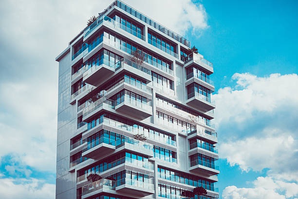 istock Tall modern condominiums with intersecting levels 586719784