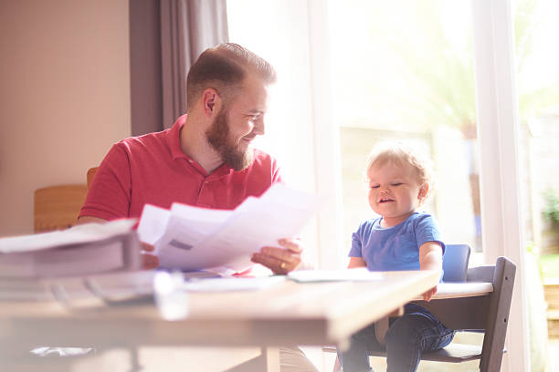istock Young father working from home with toddler 586721634