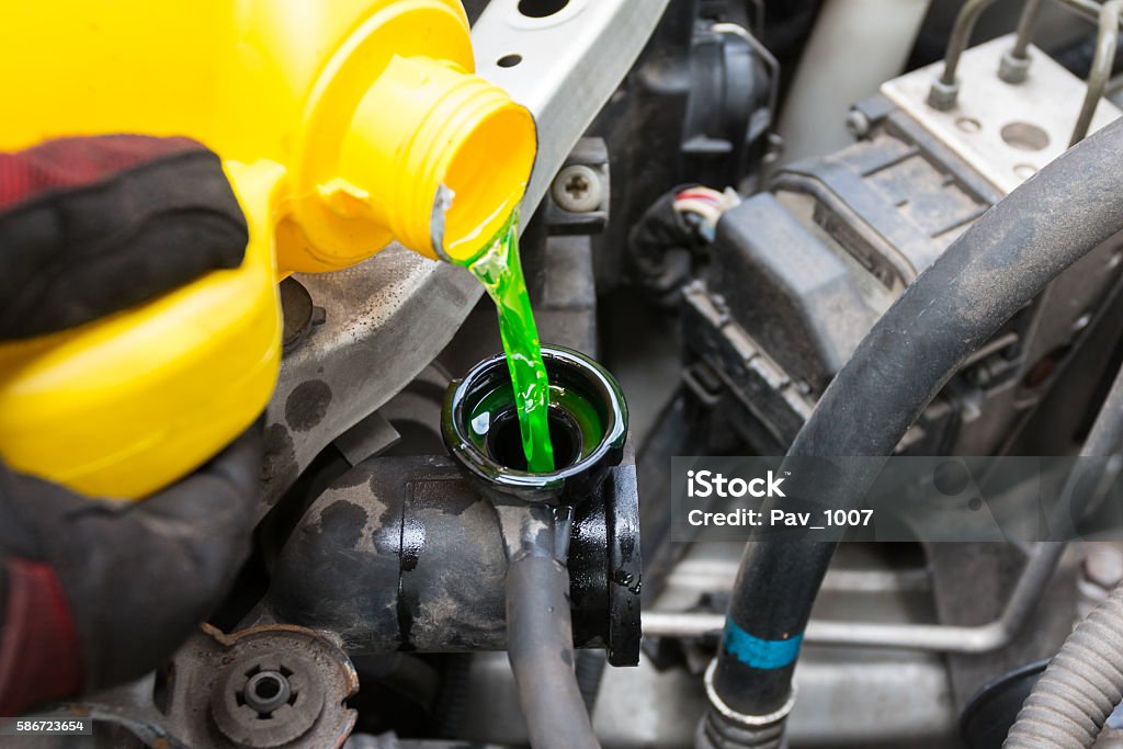 Pouring coolant Coolant Stock Photo