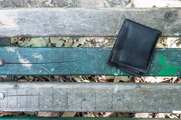 istock Lost Wallet on a Park Bench Overhead View 586725956