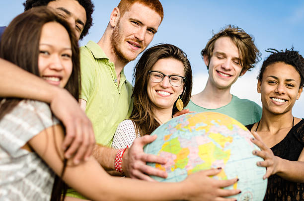 istock teenagers college student smiling with globe 586726386