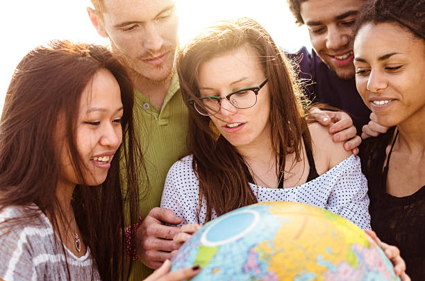 istock teenagers college student smiling with globe 586726480