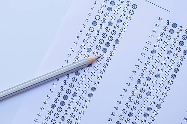 istock Standardized test form with answers bubbled in and a pencil 586727870