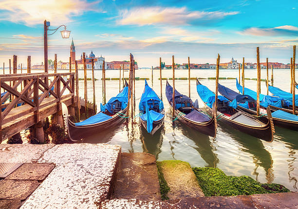 istock Gondolas moored by Saint Mark square in Venice, Italy 586728600