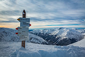 Signpost on mountain trail in winter, Kasprowy Wierch, Tatra Mountains