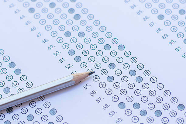 istock Standardized test form with answers bubbled in and a pencil 586729100