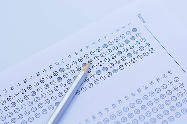 istock Standardized test form with answers bubbled in and a pencil 586730000