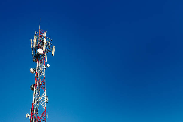 Cell phone antenna tower with blue sky background Cell phone antenna tower with blue sky background Antenna stock pictures, royalty-free photos & images