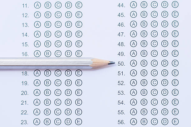 istock Standardized test form with answers bubbled in and a pencil 586730828
