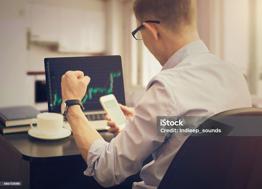 Businessman trader working in the office. Stock Market and Exchange Stock Photo
