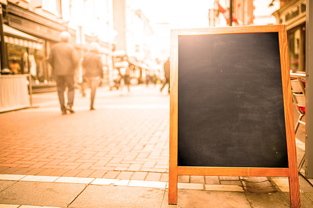 istock blank blackboard street sign 586734058