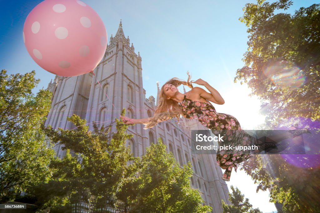 Magical floating woman floating near LDS template Mormonism Stock Photo