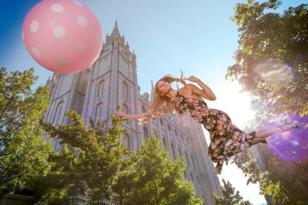 Magical floating woman floating near LDS template Magical floating woman floating near LDS template mormon woman photos stock pictures, royalty-free photos & images