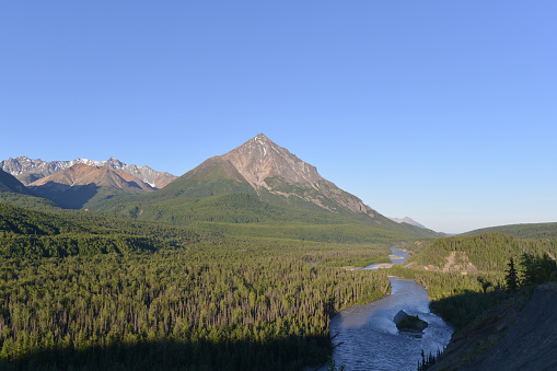 Triangular peak of the King Mountain above Matanuska River. Picture taken in July from a roadside off Glenn Highway, near Palmer, Alaska.
