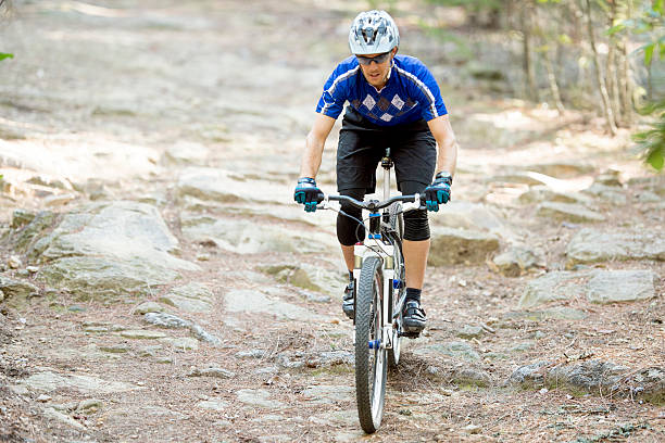 istock A man is doing extreme mountain biking through the 586737874