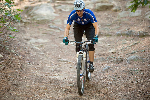 istock A man is doing extreme mountain biking through the 586737884