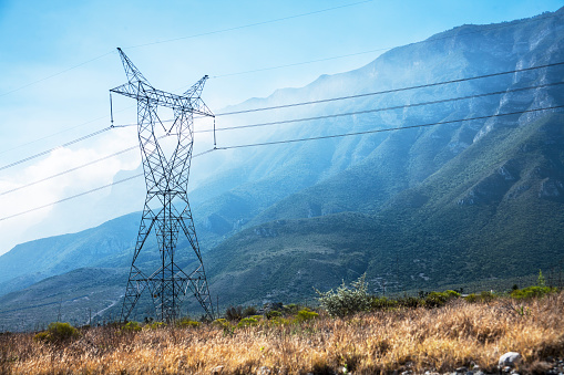 High voltage power, electrical lines with mountains.