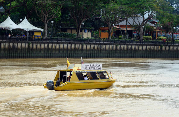 sarawak river taxi boat on the river in kuching city - sarawak state imagens e fotografias de stock