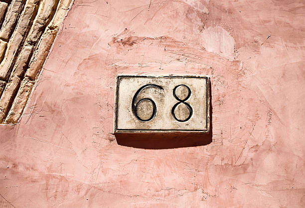 engraved building number in rome - stone textured italian culture textured effect imagens e fotografias de stock