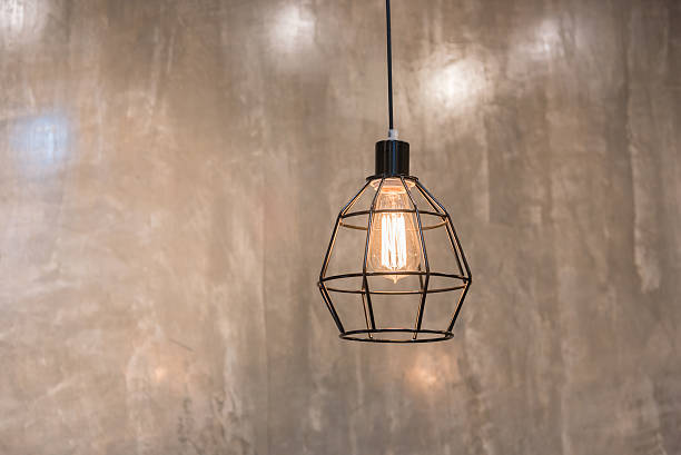 istock vintage lamps hanging from the ceiling comcrete wall. 586743070