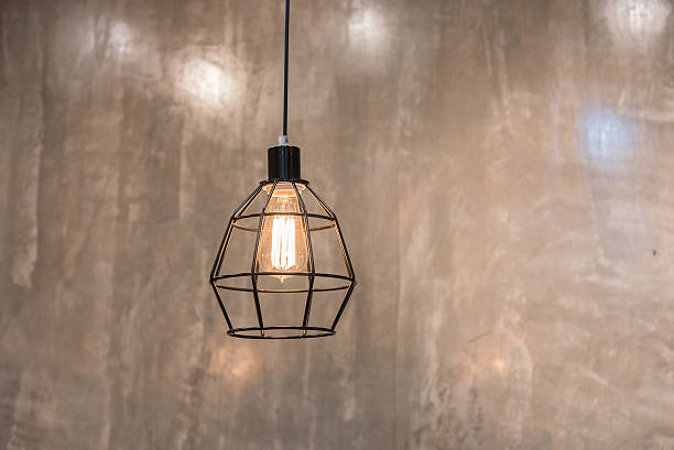 istock vintage lamps hanging from the ceiling comcrete wall. 586743230
