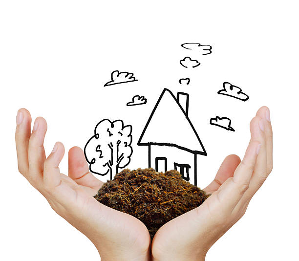 istock Business man house in  hands 586746296