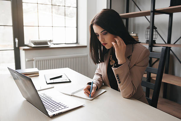 istock Concentrated businesswoman working in office 586746916