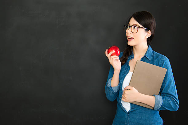 istock Young university student thinking in front of blackboard 586749754