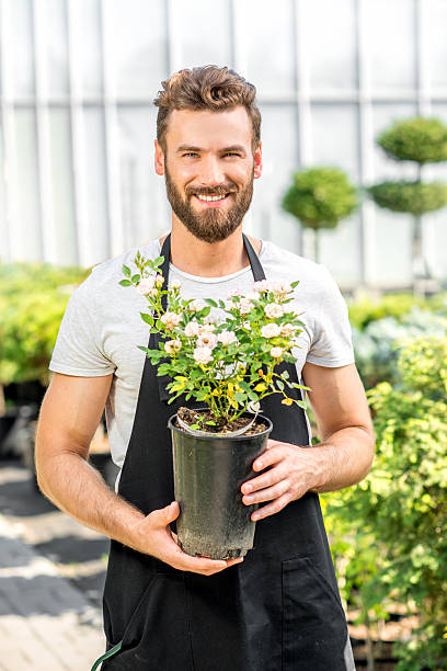 istock Gardener with a flowerpot 586920342