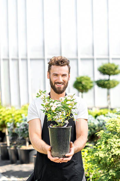 istock Gardener with a flowerpot 586920378