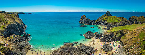 istock Cornwall tourists enjoying beach blue ocean Kynance Cove panorama UK 586921930