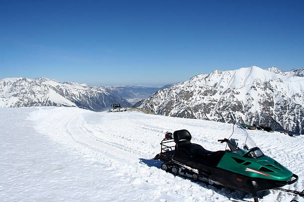 istock Snowmobile In the mountains of Caucasus 586922524