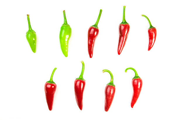 istock Many ripe red and green Chilli peppers on white 586923858