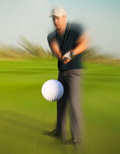istock Golf ball just coming off a golfer in swing 586923914
