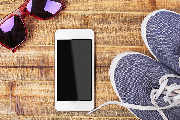 istock Glasses, sneakers and smartphone 586924094
