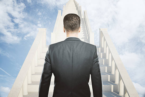 istock Success concept businessman on stairs 586924384