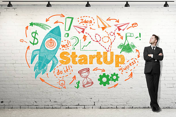 istock businessman looking on drawing Start up concept 586924554