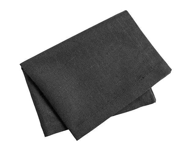 Folded black napkin isolated on white background