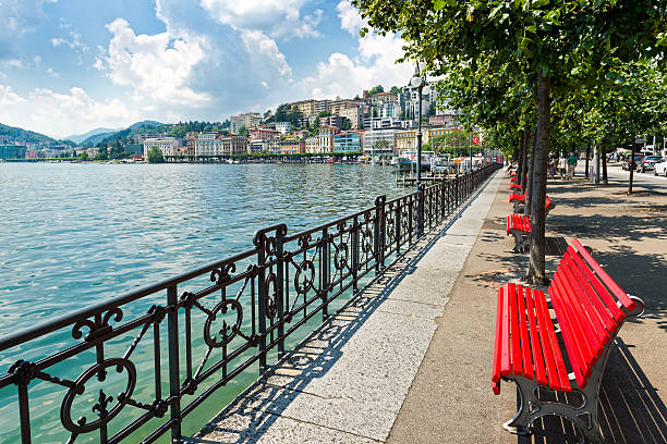 Lugano city, Switzerland Lugano, Switzerland - July 1, 2016: Lugano city on Lake Lugano in the Swiss canton of Ticino, Switzerland.  It is located at the foot of the Swiss Alps. This picture shows Lugano city looking from main street of Lugano with lake and buildings. lugano stock pictures, royalty-free photos & images