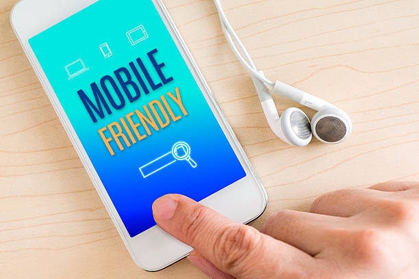 istock Hand touch smart phone and ear phone with Mobile friendly 586927294
