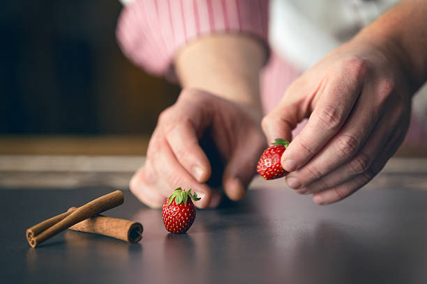 Pastry chef preparing plate