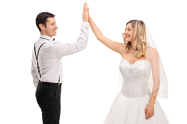 istock Groom and bride high-fiving each other 586933462
