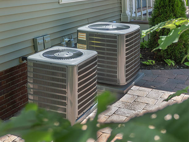 HVAC heating and air conditioning units HVAC heating and air conditioning residential units or heat pumps air duct photos stock pictures, royalty-free photos & images